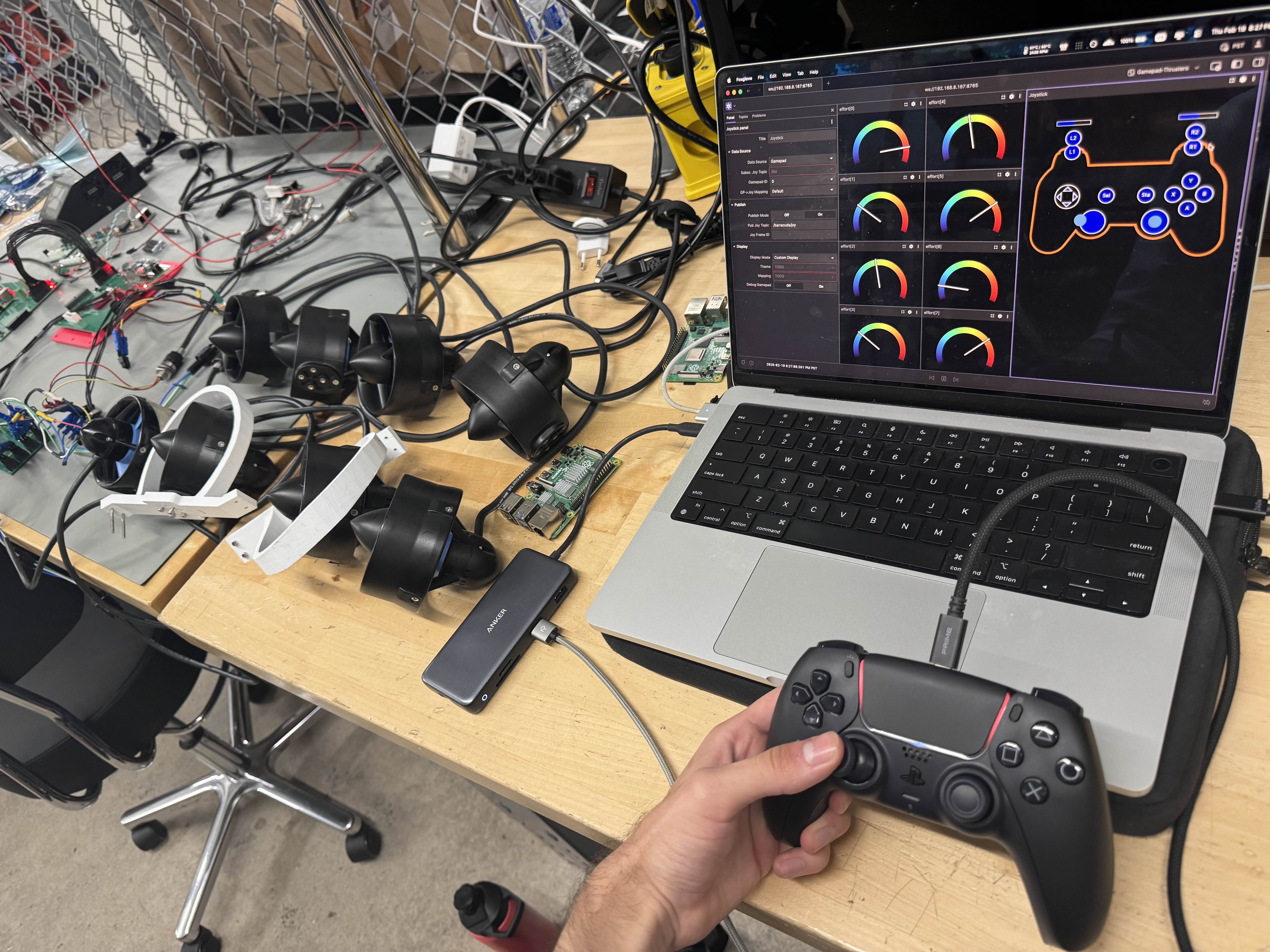 Bench setup showing thrusters, a controller, and the Barracuda control interface during early spring wet test preparation.
