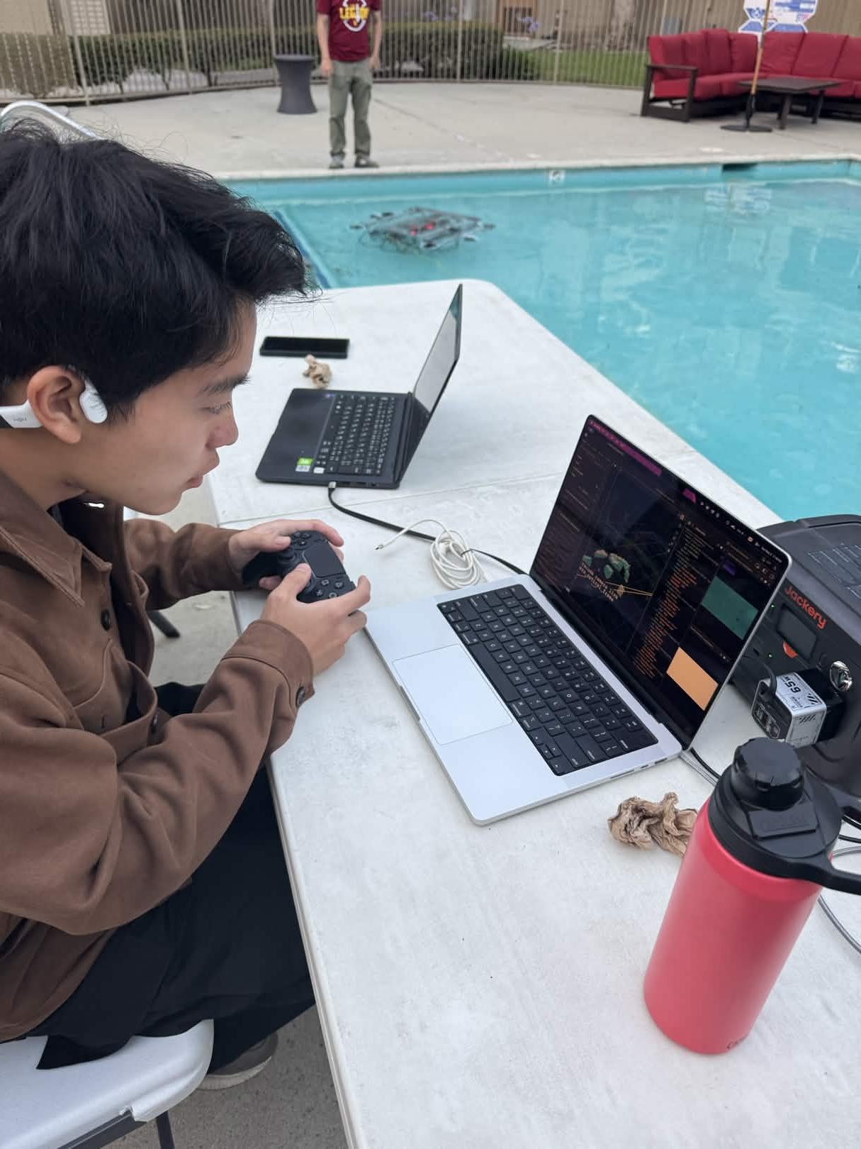 Poolside operator running the May 2 wet test while monitoring software and telemetry.