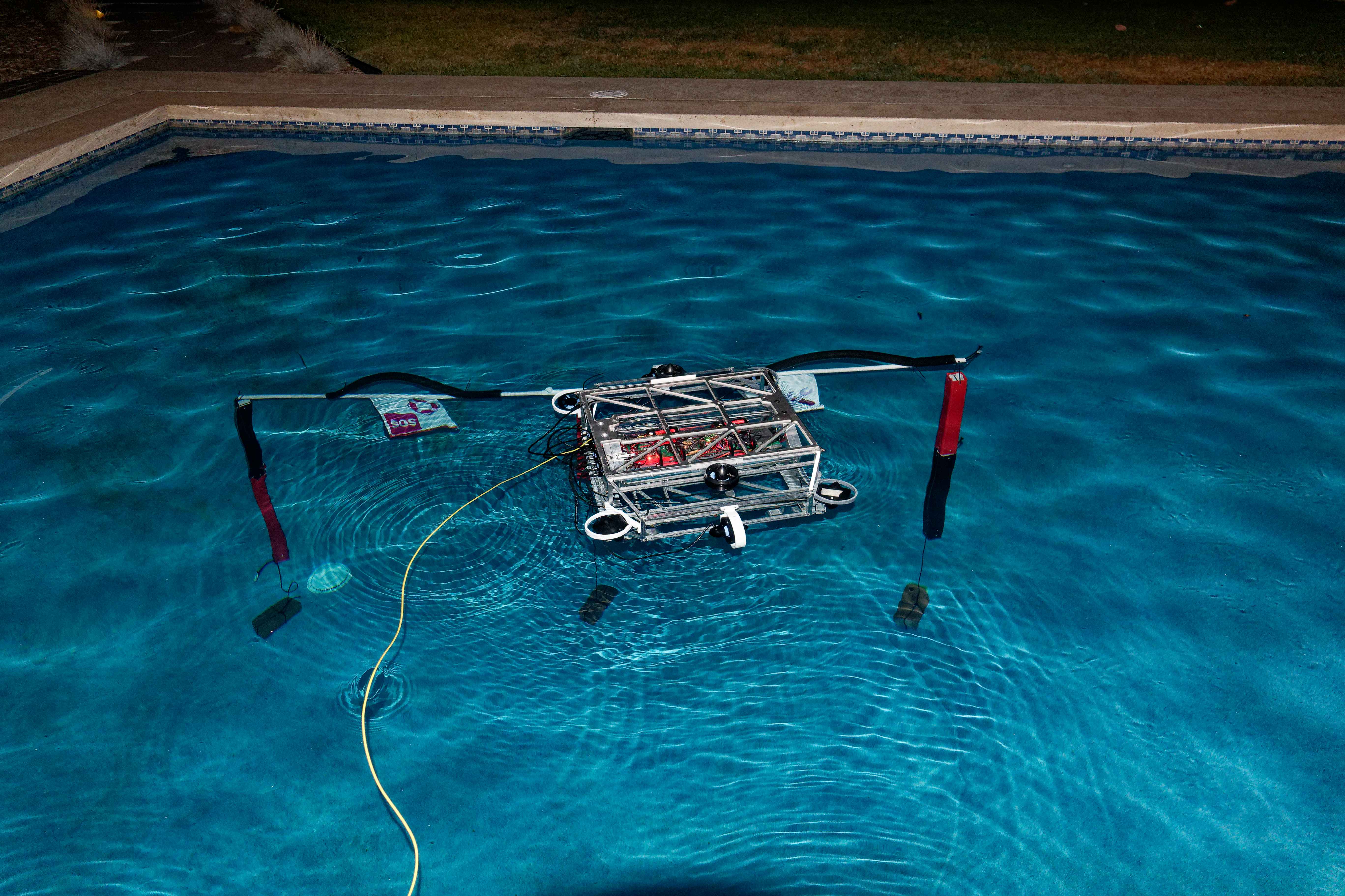 The team at the practice pool during the first night of testing at the team house.