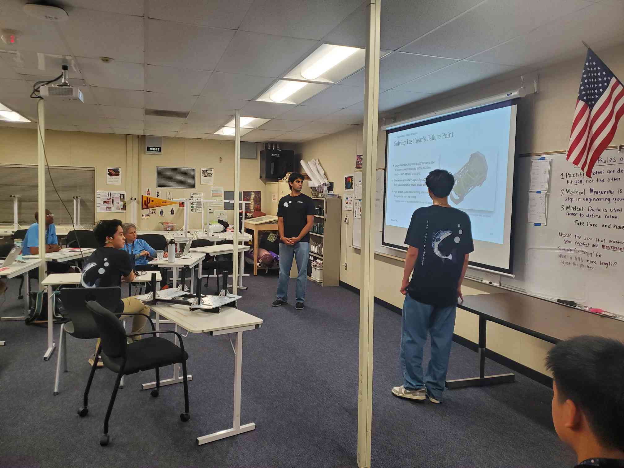 Team members presenting Barracuda's design and engineering decisions to the judges during the technical assessment.
