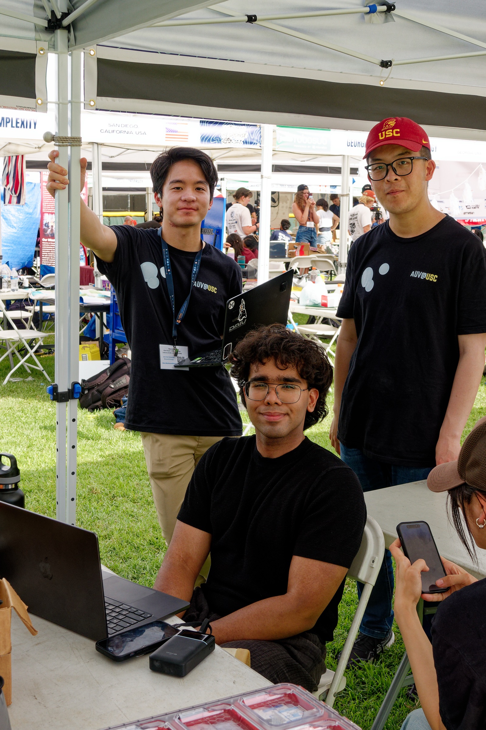 The team at the USC AUV competition tent in San Diego, working between troubleshooting sessions.